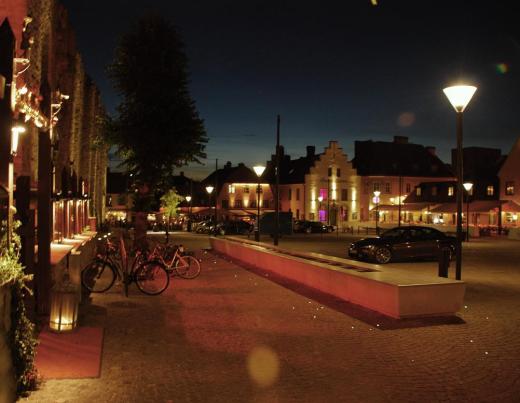 Visby's stortorget at night.  The pin pricks of light on the ground are tiny lights imbedded in the cobble stones.  They looked like stars on the ground.