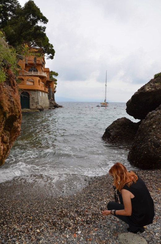 Teresa  beach combs at the public beach in Portofino