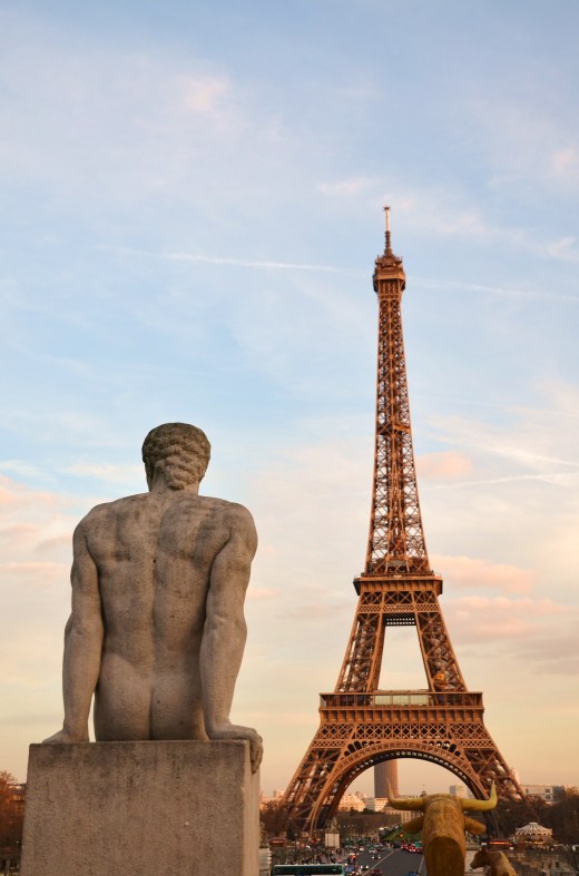 This statue, like the rest of us, seems to wait for the Eiffel Tower lights