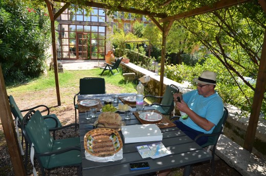 Lunch on our rental house patio. Augie uncorks a bottle of local white wine.