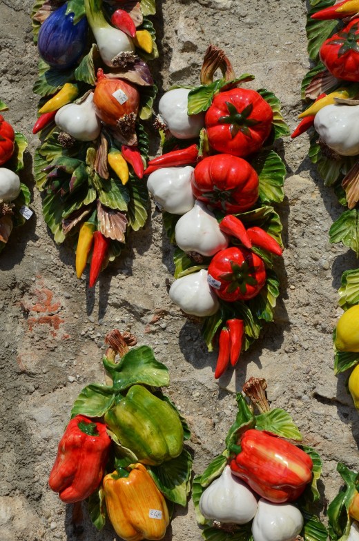 Ceramic vegetables on display on a shop wall
