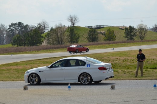 Instructor Steve watches Kim in the M5