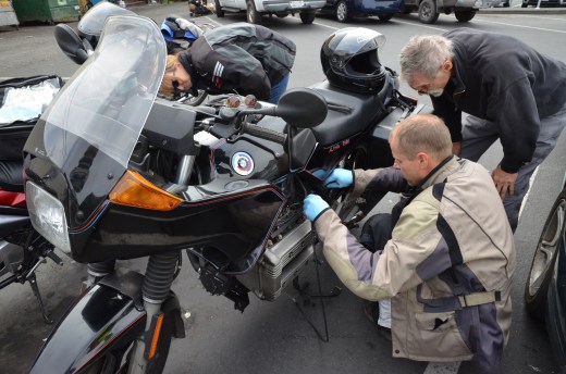Lance installs a spare clutch cable Joe was carrying in the parking lot of the brewery.