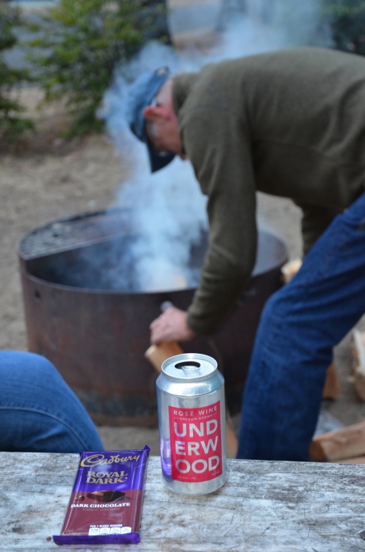 Wine in a can and chocolate by the campfire. Wine in a can travels much better in a motorcycle panier than a bottle