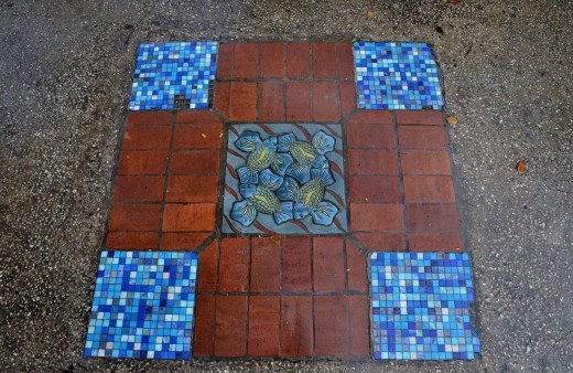 Very cool tiles inlaid into the side walk.